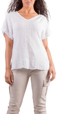 Lightweight and Breathable Waffle Cotton Top. Features a V-Neck with Cap Sleeves. 97% Cotton | 3% Elastic Made in Italy One Size Model 5'7" White Textured Spring Top, White Textured Top For Spring, Casual White Textured Tops, White Textured Tops For Spring, White Textured Cotton Tops, Textured Cotton Tops For Spring, Textured Relaxed Fit Summer Tops, Summer Textured Relaxed Fit Tops, Relaxed Fit Textured Top For Summer