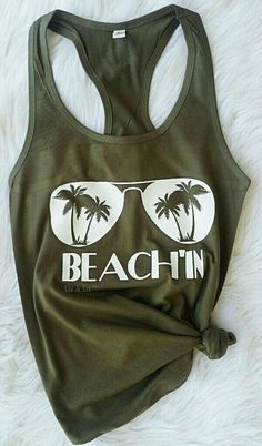 Beachin Womens Tank / Summer Shirt / Tropical Tank / Shirt for the Beach / Beach Shirt / Vacation Shirt / Cruise shirt / Bachelorette Shirt Description - Muscle Tank * 3.7 oz., 65% poly/35% viscose (unless otherwise noted) * 30 single * Relaxed, drapey fit * Low cut armhole * Curved bottom hem * Side-seamed Athletic Heather: * 52% poly/48% viscose Fun Green T-shirt For The Beach, Green Printed T-shirt For Vacation, Fun Green Tops For Vacation, Green Graphic Print Shirt For Vacation, Green Graphic Print Vacation Shirt, Cotton Tops With Palm Tree Print For Vacation, Fun Green Tops For The Beach, Cotton Top With Palm Tree Print For Vacation, Vacation Green Shirt With Graphic Print