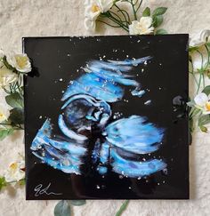 an acrylic painting of a blue bird on a black background with white flowers