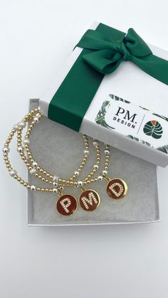 two personalized bracelets in a gift box