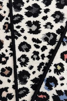 three pieces of black and white animal print fabric