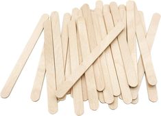 several popsicle sticks are lined up on a white surface with one stick sticking out of it