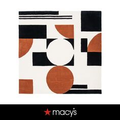 an orange and black area rug with circles on the bottom, in front of a white background