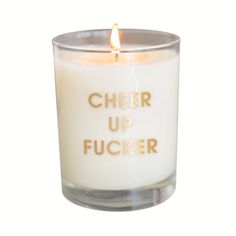 a white candle with the words cheer up fuckinger on it