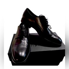 Elevate Your Formal Wear With These Sleek Black Dress Shoes From Sergio Rossi. Designed For The Modern Man, These Shoes Feature A Comfortable Fit And A Sophisticated Look. With A Size Of 11.5 In The Us Shoe Size, You're Sure To Find The Perfect Fit For Your Feet. The Brand Is Known For Their High-Quality Footwear, Making These Shoes A Great Investment For Any Wardrobe. The Black Color Adds A Timeless Touch To Any Outfit, Making Them Versatile For Any Occasion. Perfect For The Office Or A Special Modern Plain Toe Dress Shoes For Party, Modern Plain Toe Party Dress Shoes, Modern Party Dress Shoes With Plain Toe, Elegant Low-top Leather Shoes With Brogue Detailing, Party Oxfords With Branded Insole And Plain Toe, Elegant Low-top Leather Shoes With Leather Sole, Elegant Leather Low-top Dress Shoes, Business Leather Shoes With Branded Heel Counter, Elegant Low-top Leather Dress Shoes