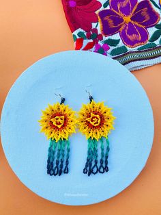 These beaded Mexican earrings are so colorful and perfect for all-day wear. They are definitely the perfect accessory to style up your look and add personality to your outfit. These lovely handmade beaded earrings are made with silver plated hooks (nickel free) and high-quality colorful beads. Finds more styles at https://www.etsy.com/shop/LatinxsCulturaViva?ref=simple-shop-header-name&listing_id=1085543761&section_id=26730499 Thank you so much for visiting. If you have any questions, please do Southwestern Style Earrings For Summer Festival, Traditional Yellow Earrings For Summer, Southwestern Style Summer Festival Earrings, Southwestern Style Earrings For Summer, Traditional Yellow Earrings For Festival, Southwestern Handmade Earrings For Beach, Handmade Southwestern Earrings For Summer, Multicolor Bohemian Earrings For Fiesta, Handmade Yellow Earrings For Festivals