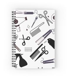 a spiral notebook with scissors, combs and hairdryers on the front cover