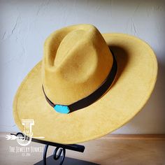 If you’re looking for the perfect accessory to complement your favorite boho style, look no further. The Boho-Style Western Felt Hat w/ Smooth Leather Hat Band by The Jewelry Junkie is absolutely everything that you need. Not only is it easy to incorporate into any and all outfits, but the genuine leather of the band immediately elevates whatever it is you’re wearing. Match your one-of-a-kind hat with any one of the matching accessories that we have for a completely gorgeous look. One Size Hat w Handmade Turquoise Bohemian Hat Band, Turquoise Bohemian Hat For Western-themed Events, Handmade Bohemian Felt Hat For Ranch, Handmade Artisan Turquoise Hat, Artisan Turquoise Festival Hat, Artisan Handmade Turquoise Hat, Turquoise Fedora For Festivals, Adjustable Turquoise Fedora, Turquoise Flat Brim Handmade Hat