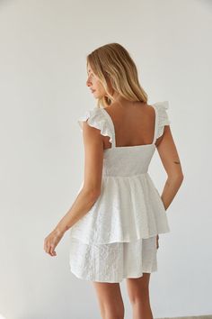 Get ready for sunny days in the Ashlyn Sweetheart Ruffle Fit and Flare Mini Dress! This white mini dress features a feminine sweetheart neckline, delicate flutter sleeves, and a flattering fit and flare silhouette. Unique with a floral texture and double tiered skirt, this white babydoll dress is ready to bloom! Accessorize to complete the look!Details 100% Polyester Elastic straps Smocked back panel Partially lined Hand wash cold/ hang dry Fit And Flare Mini Dress, White Babydoll Dress, White Babydoll, Sorority Rush, Floral Texture, Flare Mini Dress, Tiered Skirt, Flutter Sleeves, Babydoll Dress