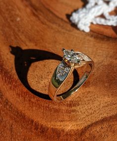 a couple of rings sitting on top of a wooden table