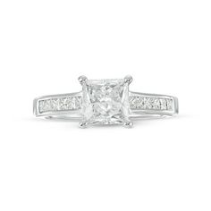 a princess cut diamond ring with channeled shoulders