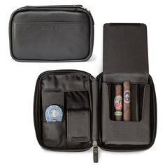 an open black case with four cigars in it on a white surface and one opened to show the contents