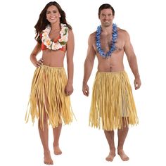 a man and woman dressed in hula skirts with flowers on their heads standing next to each other