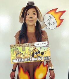 a woman wearing a costume made to look like she is holding a sign that says, this is fine