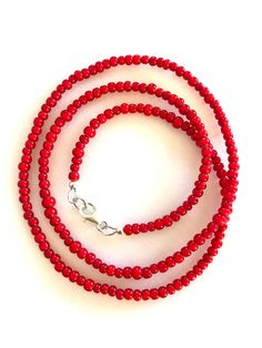 Men's long beaded skinny necklace with premium handmade African glass trade beads in rich true red color. Beautiful high quality polished red glass beads known as African White Heart beads due to bright white color painted inside each bead are approximately 3 to 4 mm in diameter. Necklace is 24 inches long so it can slip over your head easily but also has .925 sterling silver lobster claw clasp closure. Popular look worn with simple white tee shirt. Cheap Red Beaded Necklace With Silver Beads, Red Beaded Glass Necklace, Red Oval Beaded Single Strand Necklace, Red Hand-strung Beaded Necklaces, Red Oval Beaded Necklaces Hand-strung, Red Glass Necklace With Spacer Beads, Red Hand-strung Oval Beaded Necklaces, Vibrant Red Beaded Necklace, Red Oval Beaded Hand-strung Necklace