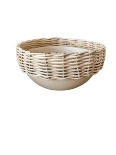 a white bowl with wicker in the center on a white background, it is empty