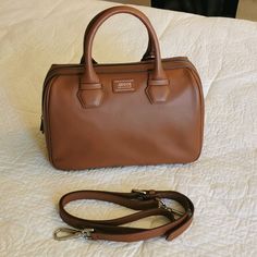 Medium Size, Genuine Leather Interior Zippered Pocket With Leather Shoulder/Crossbody Adjustable Strap Brand New, Never Used, With Original Dust Bag 12"L X 5.5"H X 8"W Classic Handheld Satchel With Dust Bag, Cognac Top Handle Satchel With Dust Bag, Luxury Cognac Satchel With Detachable Strap, Formal Cognac Satchel With Handles, Cognac Satchel With Detachable Strap For Shopping, Classic Handheld Satchel With Handles, Classic Handheld Satchel, Cognac Crossbody Satchel With Dust Bag, Classic Cognac Satchel With Detachable Handle