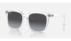 Ray-Ban RB4401D sunglasses are a classic style with a modern twist. The square shape with dark grey lenses and transparent grey frames is ideal for everyday wear. These sunglasses are designed for everyone who wants to wear them and can be worn with any outfit. Classic Gray Sunglasses With Tinted Lenses, Classic Gray Tinted Sunglasses, Classic Gray Square Frame Sunglasses, Casual Clear Square Frame Sunglasses, Classic Gray Sunglasses With Mirrored Lenses, Casual Clear Wayfarer Sunglasses, Classic Clear Wayfarer Sunglasses, Trendy Clear Sunglasses For Formal Occasions, Casual Clear Sunglasses With Mirrored Lenses