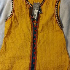 Heirloom Quality Top With Gorgeous Detail. Colors Are Vibrant. Mustard, Black, Gold, Red, Blue. Feminine Pleats. Hand Locked Print. Fabric Covered Buttons. Yellow Sleeveless Blouse For The Beach, Sleeveless Yellow Blouse For The Beach, Yellow Sleeveless Blouse For Beach, Yellow Cotton Tank Top For Spring, Cotton Sleeveless Vest For Festival, Festival Multicolor Vest Top, Yellow Sleeveless Blouse For Summer, Casual Sleeveless Blouse For Festival, Sleeveless Mustard Tops For Spring