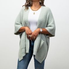 Stay warm and chic in our Monica Cozy Ruana! Made with soft fabric, this ruana features pockets for convenience. Whether you're running errands or going out for a night on the town, the Monica Cozy Ruana provides comfort and style. One-size Soft Knit Outerwear For Cold Weather, Oversized Super Soft Winter Outerwear, Cozy One-size Outerwear For Cold Weather, Cozy Outerwear For Cold Weather One Size, One Size Soft Knit Open Front Outerwear, One Size Open Front Soft Knit Outerwear, One-size Open Front Soft Knit Outerwear, Soft Knit Outerwear For Loungewear, One Size, One Size Soft Knit Loungewear Outerwear