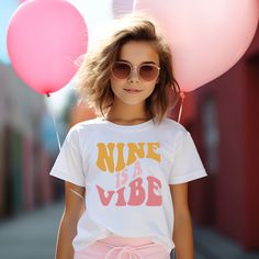 This Vibe Birthday shirt is the perfect birthday top for any groovy party. Customize for any age! Examples : Five is a Vibe, Nine is a Vibe. Perfect for your retro birthday, hippie birthday Groovy Vibes!  Our Birthday Baby graphic makes this a must have birthday shirt! ✨ HOW TO ORDER ✨ ✧ Select your options from the Drop Downs ✧ ADD TO CART * * * * * * * * * * * * * * * * * * * * * * * * * * * * * 👕 TOPS 👕 ✧T-SHIRT - soft cotton, crew neck unisex tee * * * * * * * * * * * * * * * * * * * * * * Five Is A Vibe Birthday Party Outfit, Good Vibes Only Birthday Party, 9th Birthday Shirt Girl, Playful Birthday T-shirt With Text Print, Playful Text Print Birthday T-shirt, Playful Letter Print Tops For Birthday, Playful Spring Party Tops, Playful Summer Party Tops, Trendy Pink T-shirt For Birthday