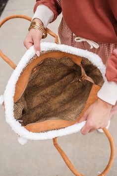 The IT bag for fall! Our Teddy Cozy Tote Shoulder Bag features trendy sherpa trim with zippered closure and a camel body. No pockets. It Bag, Camel, Caramel, Trim, Shoulder Bag, Zipper