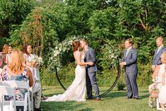 a bride and groom standing at the end of their wedding ceremony