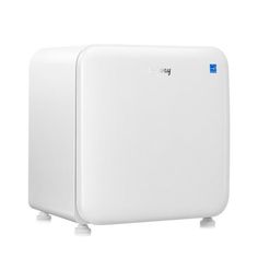 a white refrigerator freezer sitting on top of a white countertop next to a wall