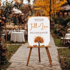 a welcome sign for a fall in love wedding