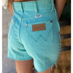 Wrangler Donna Cutoff Shorts Teal Blue (More Of A Teal/Green Tint Than Shown In Photos Under Photographing Lighting Conditions. Stock Photos Of Item Being Worn Are Most Accurate) 100% Cotton Casual Light Wash Bottoms For Rodeo, Casual Turquoise Shorts, Turquoise Casual Shorts, Blue Denim Western Bottoms, Western Style Blue Denim Bottoms, Casual Turquoise Short Bottoms, Turquoise Casual Short Bottoms, Blue Retro Bottoms With Frayed Hem, Blue Mid-rise Bottoms For Rodeo