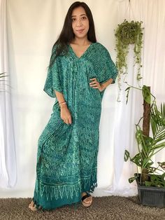 Hand Stamped Batik Dyed Long Kaftan Dress in teal green color hues. This Long Kaftan Maxi Dress made of soft, delicate and lightweight rayon with 2 hidden pockets on each side. Its so convenience to wear a dress with 2 big pockets to store your phone, keys and any other personal belongings without Spring V-neck Kaftan With Batik Print, V-neck Batik Print Festival Dress, Bohemian V-neck Maxi Dress With Batik Print, Bohemian V-neck Dress With Natural Dye, Green V-neck Batik Print Dress, Hippie V-neck Free Size Kaftan, Green Free Size Bohemian Kaftan, Green Bohemian Free Size Kaftan, Green Flowy Kaftan With Short Sleeves