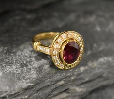 Gold Ruby Ring set with Created Ruby in perfect diamond cut, flawless clarity & deep red color, at 10x8mm, 3 Carats, with small CZ Diamonds on the band. Gold Victorian Ring design made of Solid 925 Sterling Silver ☞ made to last.**The ring is plated with 18k Gold (the thickest plating - 3 Micron) over Solid 925 Sterling Silver.☞ Choose your size ☞ I resize (before shipping) for FREE to Any size*Matching Pendant: www.etsy.com/listing/929984209Matching Earrings: www.etsy.com/listing/963504392⌛ Heirloom Red Diamond Ring With Halo Setting, Red Diamond Ring With Bezel Setting For Anniversary, Heirloom Ruby Ring With Vvs Clarity, Red Ruby Diamond Ring With Bezel Setting, Antique Engagement Rings Victorian, Red Diamond Ring, Antique Ruby Ring, Ruby Ring Set, Red Ruby Ring