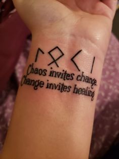 a woman's wrist with a tattoo that reads chaos inverts change, change infinites reality