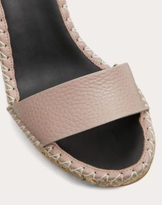 Valentino Garavani Double Rockstud wedge in elk-print calfskin leather. - Platinum-finish studs - Tonal calfskin ankle strap - Rope and rubber sole - Heel height 105 mm / 3.7 in. with 15 mm/0,6 in. platform - Made in Italy Pink Leather Wedge Heel Sandals, Pink Leather Wedge Sandals, Pink Leather Wedge Sandals With Open Heel, Pink Leather Open Heel Wedge Sandals, Calf Leather Wedge Heel Sandals, Calf Leather Wedge Sandals, Luxury Beige Leather Wedge Sandals, Wedge Sandal, Valentino Garavani