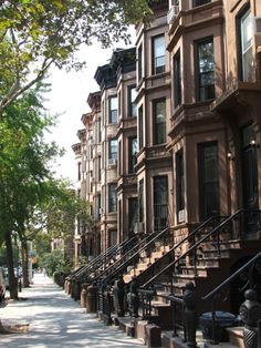 row houses line the street in an urban setting