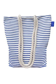 This large blue and white striped canvas tote bag is fully lined, has cotton rope handles and a zipper top. 15.75"W x 16.75"H x 5"D 100% Cotton Canvas Fully Lined Blue Canvas Bag For The Beach, Nautical Beach Bag In Sail Color, Nautical Sail-colored Beach Bag, Nautical Style Beach Tote Bag, Nautical Bags For Daily Summer Use, Summer Nautical Style Tote Bag, Blue Nautical Beach Bag, Blue Nautical Travel Bag, Hammitt Handbags