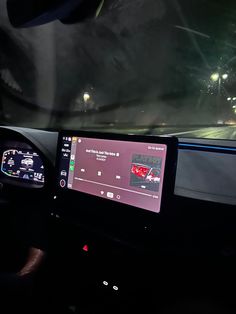 the dashboard of a car at night time