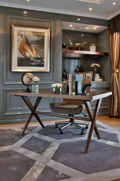 a home office with gray walls and carpet