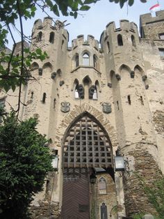 an old castle building with a large door