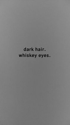 a black and white photo with the words dark hair whiskey eyes