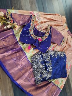 This Traditional Half Saree Set is a must-have for any woman looking to add a touch of elegance and tradition to her wardrobe. Made from premium quality Kanchi material, this saree set is not only beautiful but also durable and comfortable to wear. The set includes a blouse that is stitched and comes in a size 34, with inner margins that can be expanded up to size 40. For those who need a size 32, alterations can be done upon request. The lehenga is also expandable and has inner margins to incre Designer Wear Tissue Silk Sets With Cutdana, Designer Tissue Silk Sets With Cutdana, Designer Wear Sets With Cutdana In Tissue Silk, Blue Tissue Silk Saree Set, Traditional Blue Tissue Silk Sets, Saree Set With Unstitched Blouse For Wedding, Navratri Tissue Silk Sets With Dori Work, Designer Tissue Silk Set With Dori Work, Traditional Drape Sets In Tissue Silk With Dori Work