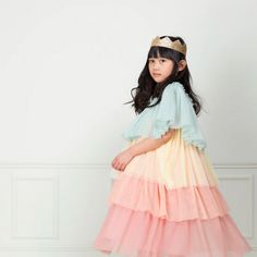 This beautiful ruffled dress and gold crown set is perfect for any celebratory event. A special gift to be added to a dress up box for imaginative play and parties. The dress is crafted from layers of tulle in mint, pale yellow, peach pink and dusky pink It is lined with pink cotton The straps are adjustable, for the ideal fit The crown is crafted from a gold glitter fabric on the outside, pink felt on the inside, and has elastic at the back Product dimensions: (3-4 years) Length - 31 inches Product dimensions: (5-6 years) Length - 33 inches Dress Up Boxes, Glitter Crown, Princess Dress Up, Pixie Styles, Meri Meri, Up Costumes, Princess Costume, Dress Up Costumes, Beautiful Costumes