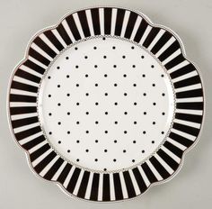 a black and white plate with dots on it