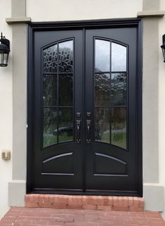 a black double door with two sidelights