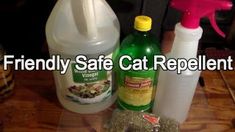 two bottles of cat repellent sitting on top of a table