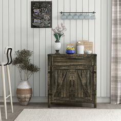 a wooden cabinet sitting in front of a white wall