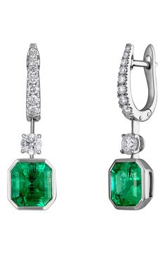 An octagon-cut Cololmbian emerald appears to float at the bottom of these diamond-anchored drop earrings set in icy platinum. 1 1/4" drop Hinge with snap-post closure Total emerald weight: 6.50ct. Total diamond weight: 1.20ct. Color: G–H Clarity: VS Platinum/Colombian emerald/diamond Made in the USA >Diamond Guide Diamond Guide, Colombian Emeralds, Deco Jewelry, Art Deco Jewelry, Emerald Diamond, G H, Earrings Set, Myanmar, Earring Set