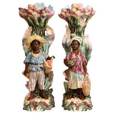 two vases with flowers on them and one has a woman holding a basket in her hand