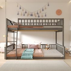 a bunk bed with two sets of beds underneath it and a rug on the floor