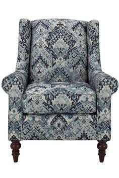 a blue and white patterned chair with dark wood legs, on a white background the chair is upholstered in an ornate pattern